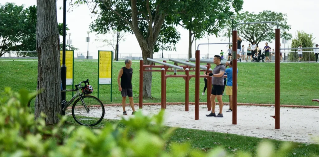 a bunch of people exercising at a park