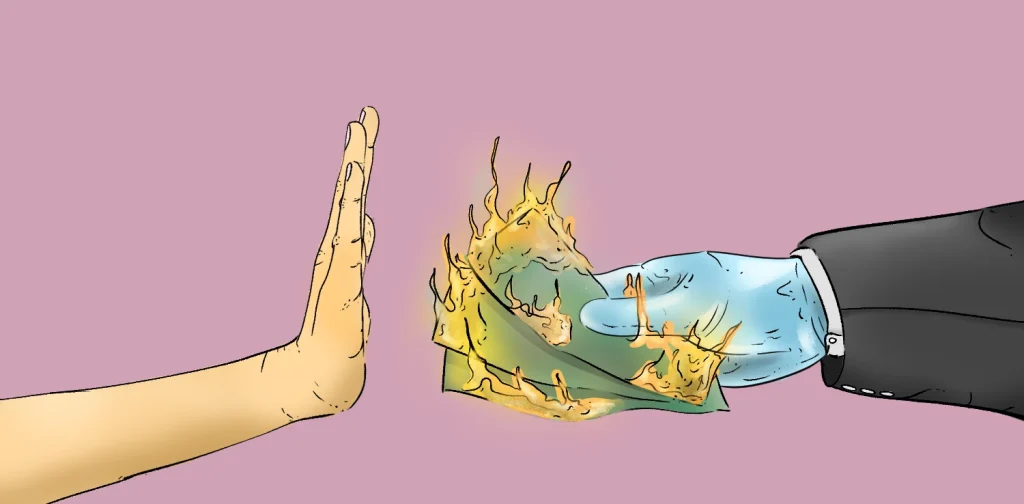 Sebuah tangan menolak uang yang terbakar dari seseorang berjas.